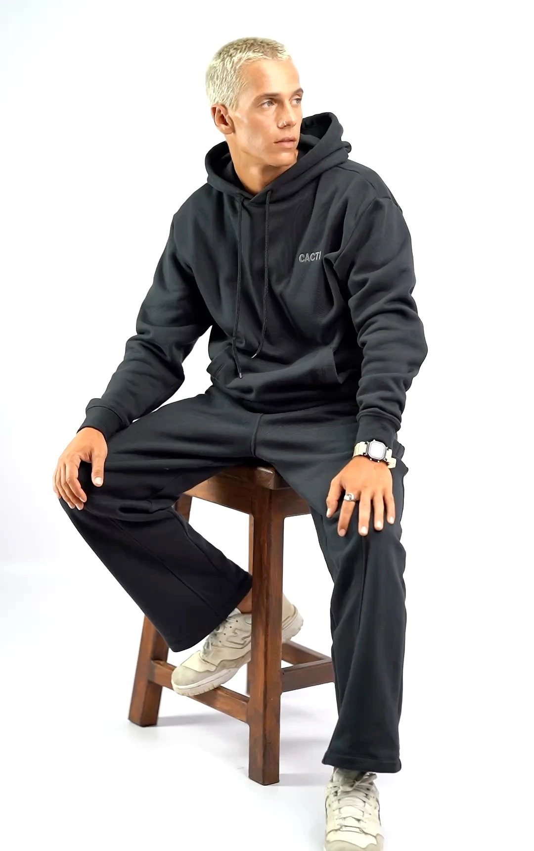 Model wearing black Cacti tracksuit